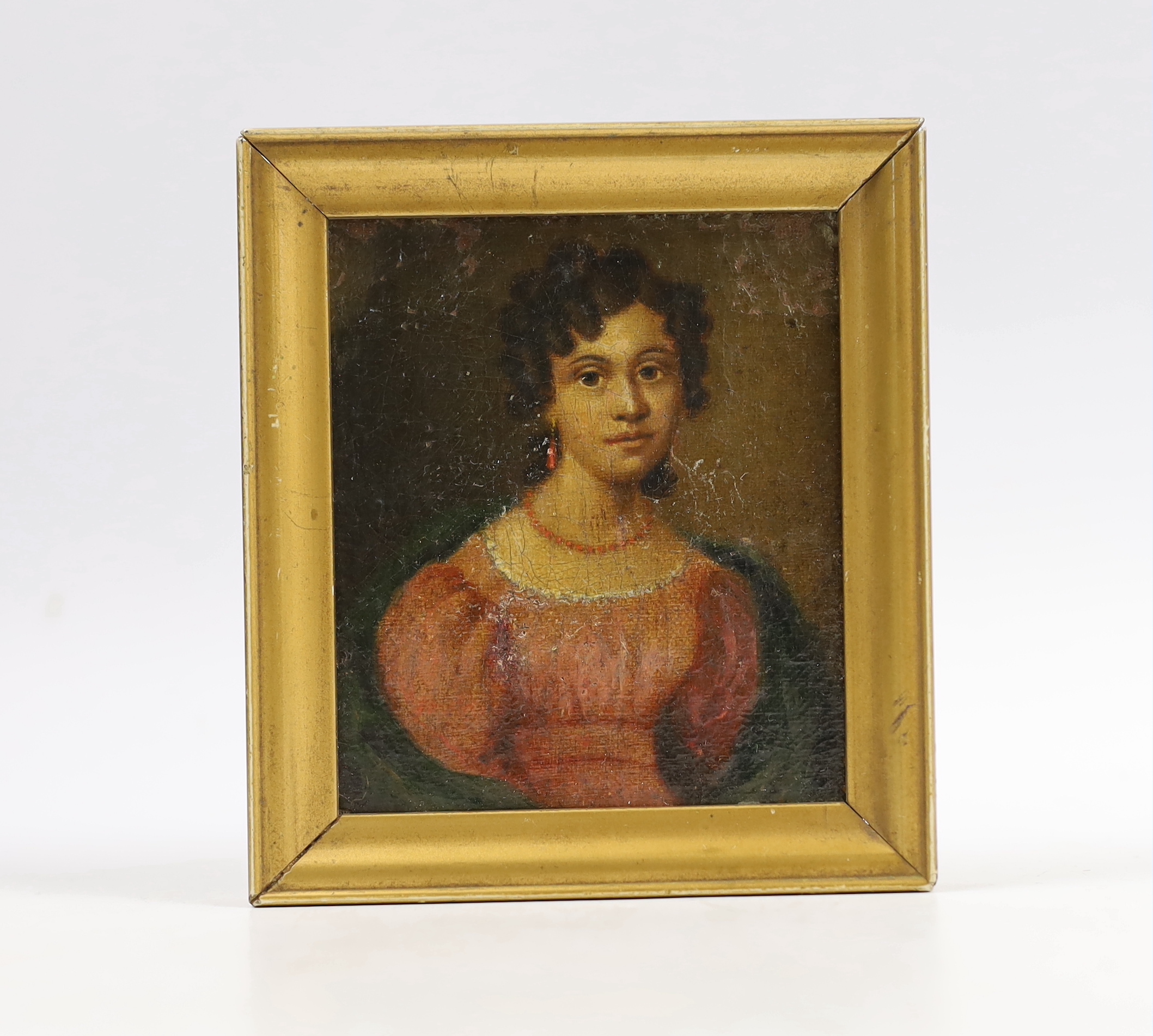 Early 19th century, oil on board, Portrait miniature of a Regency lady wearing coral earrings and necklace, 9 x 7.5cm